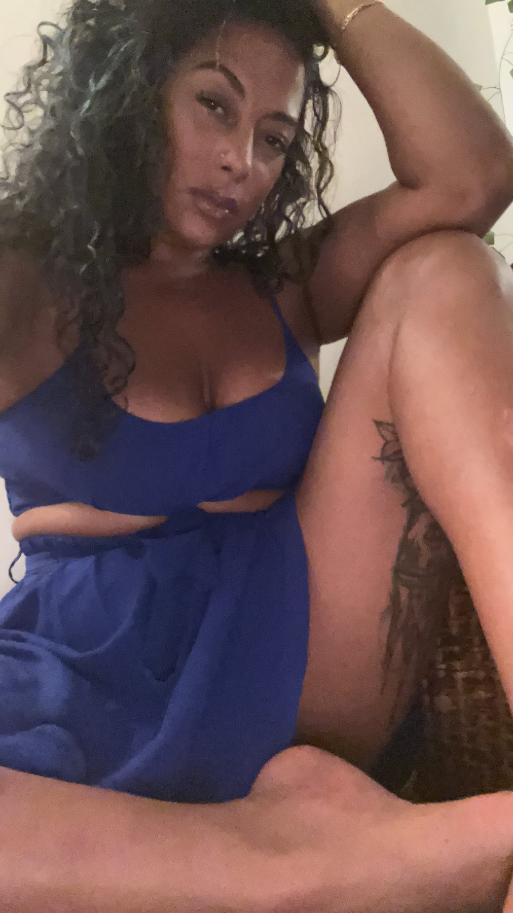 Brittney J in blue outfit at home