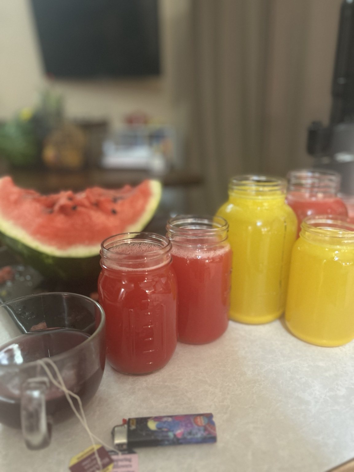 Fresh red and yellow juices in jars